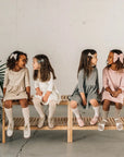 models wearing leather bows and shoes