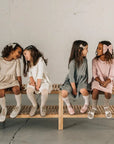 models wearing leather bows and shoes