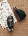 black leather first walker, brown sole, black laces, beige inside
