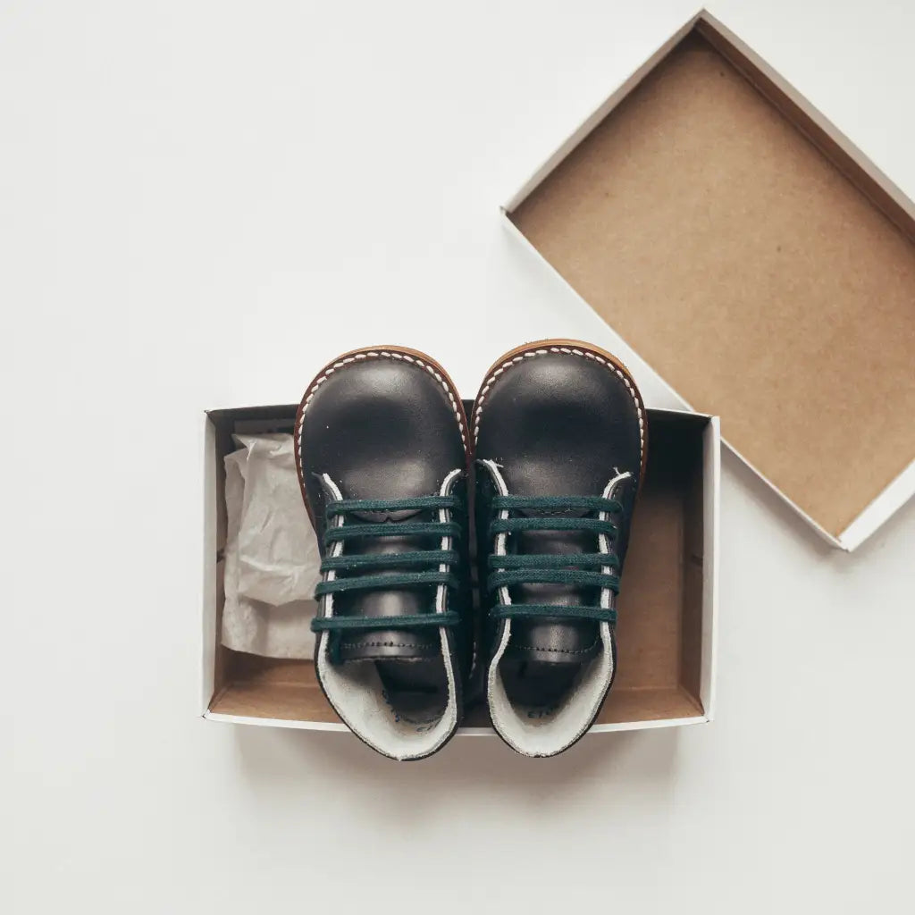 navy leather first walker, brown sole, navy laces, beige inside