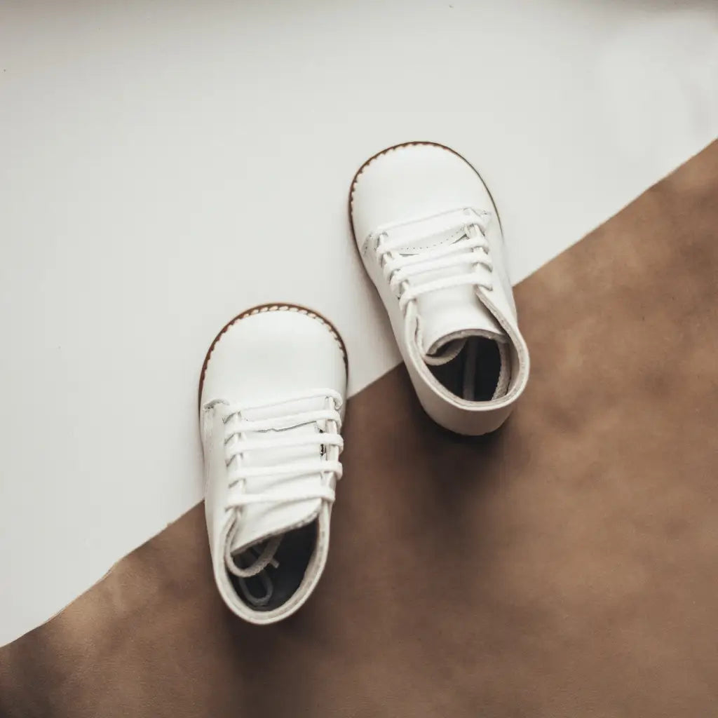 white leather first walker, brown sole, white laces, beige inside