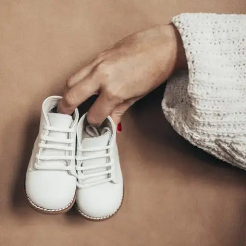 white leather first walker, brown sole, white laces, beige inside