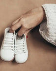 white leather first walker, brown sole, white laces, beige inside