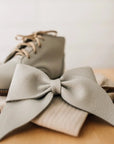 leather bow featured in fog