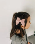 leather bow featured in color peony