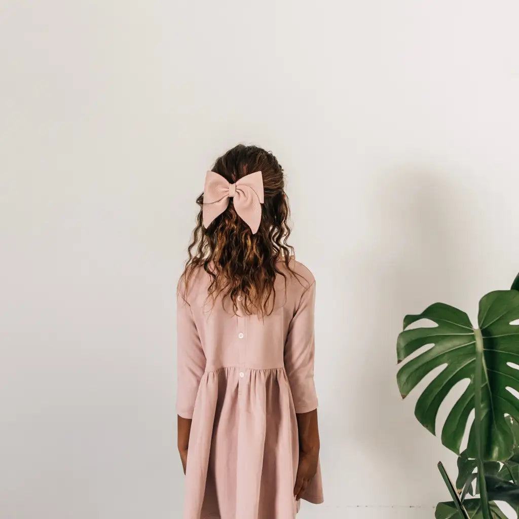 leather bow featured in color peony