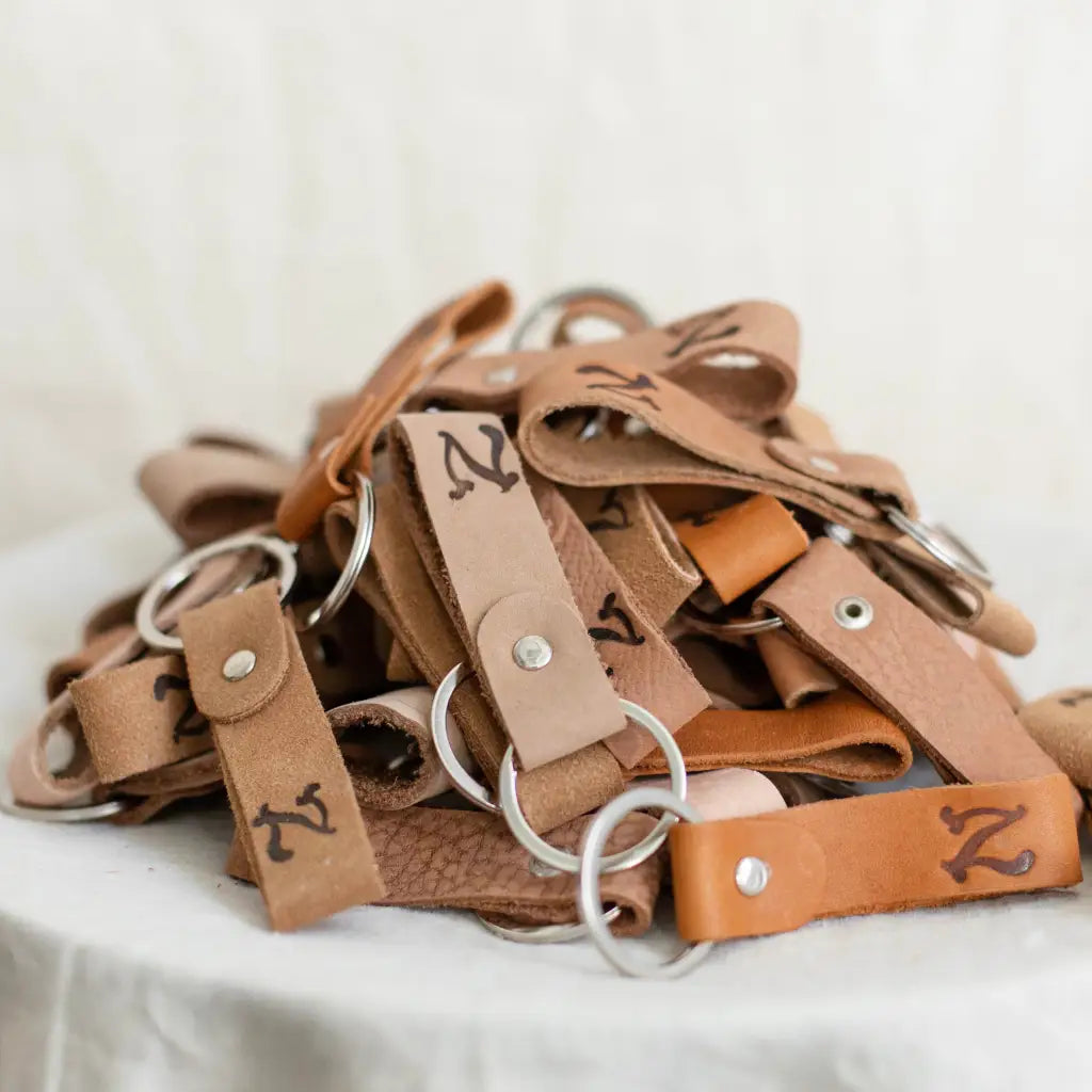 upcycled leather keychains in various shades of brown