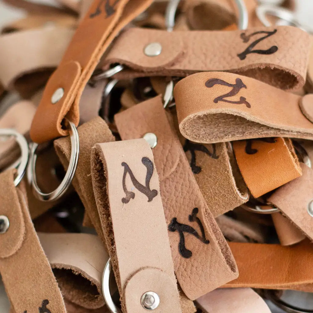 upcycled leather keychains in various shades of brown
