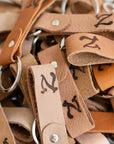 upcycled leather keychains in various shades of brown