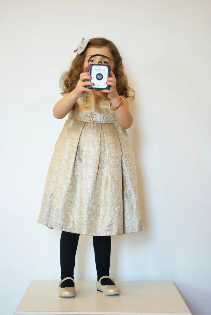 vintage style little girl with gold shoes