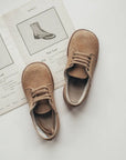 tan suede leather saddle shoes, light brown laces, brown sole