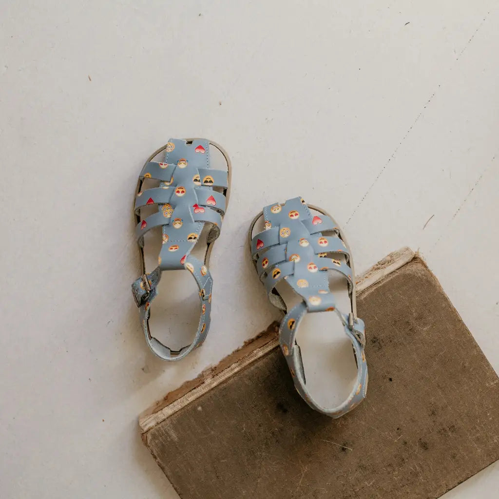 blue leather sandal with emoji pattern
