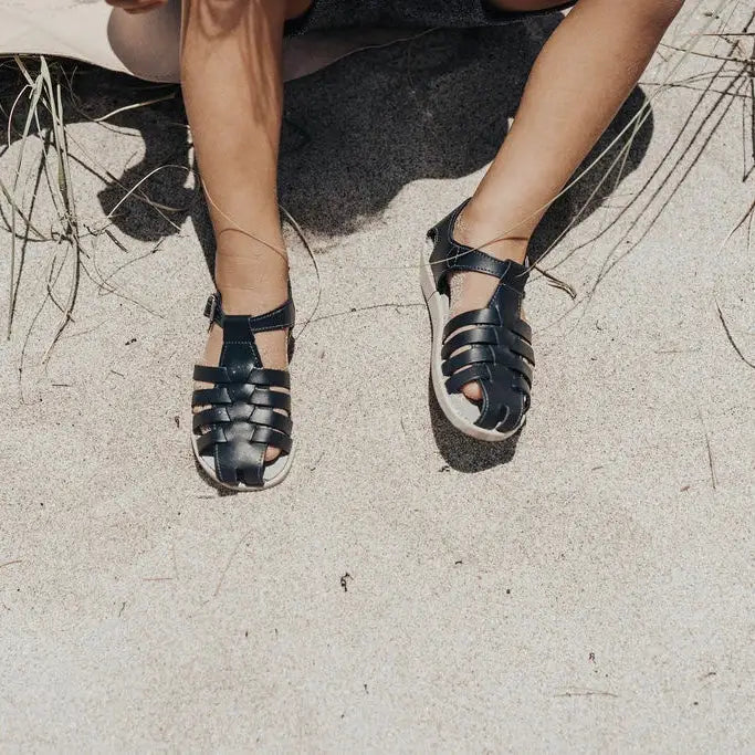 navy leather sandal with beige sole