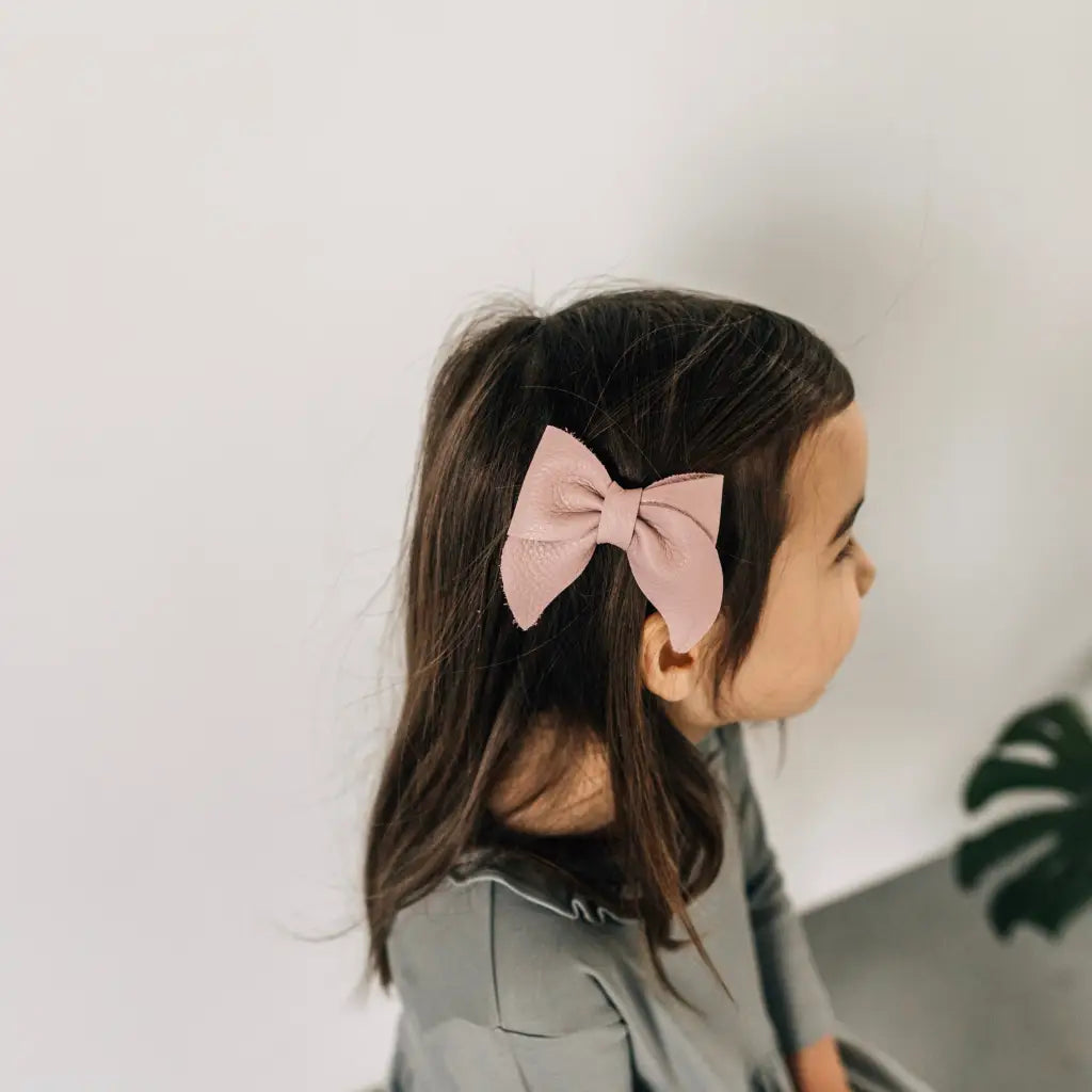 leather bow featured in color peony