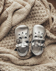 silver leather crib shoes, two straps, petal shaped holes, white insides