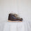 Pair of brown leather shoes with beige laces on a light background